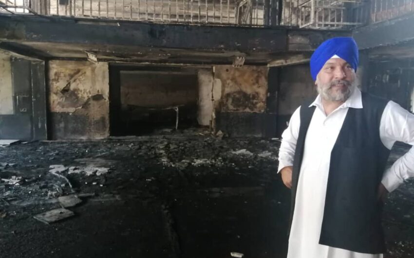 IEA officials distribute cash assistance among victims of Sikh temple attack